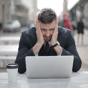 man is overwhelmed by updating his website